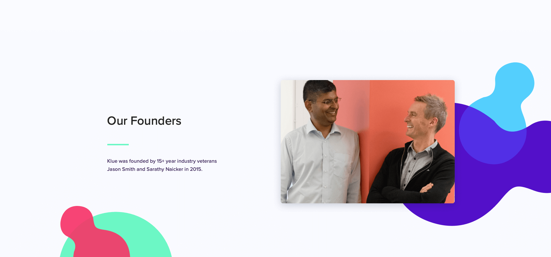 Klue's 'about us' page, which has an image of their founders Jason Smith and Sarathy Naicker laughing with each other. The background had colorful shapes in theme with their homepage.